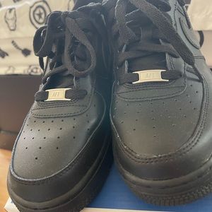 Nike air force 1 all black. Kid size 7, can fit women size 8.5 or men size 7.